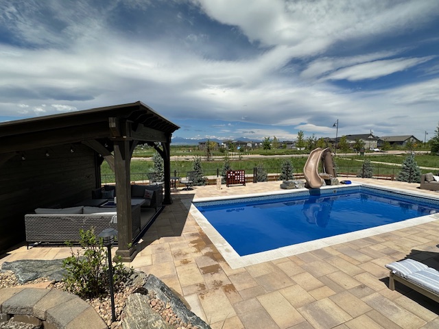 Outdoor dining area with custom pergola