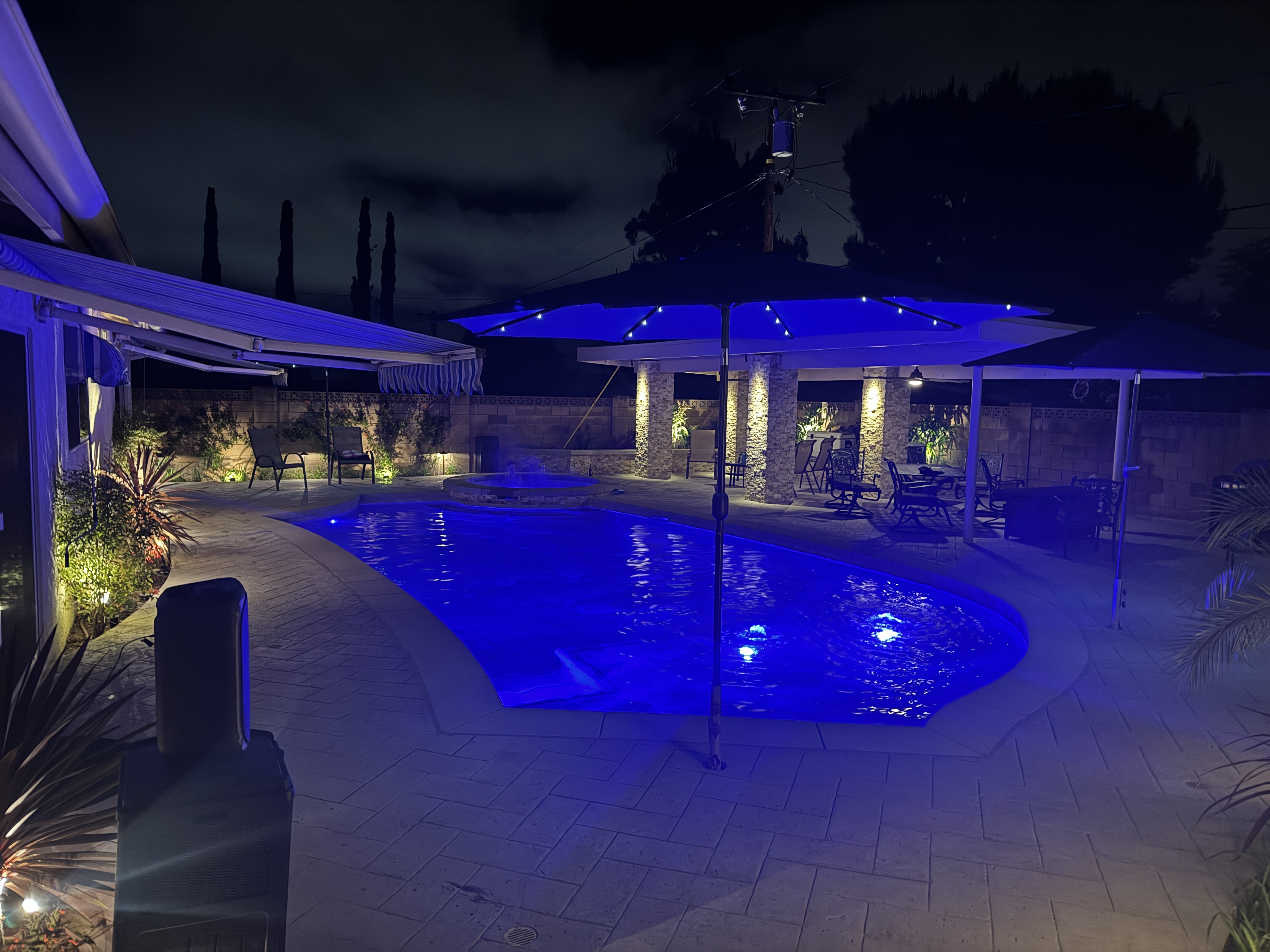 C4 Unlimited outdoor living project in Colorado showcasing pool cover and outdoor kitchen installation